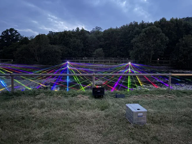 Colourful lasers shoot out over the lake