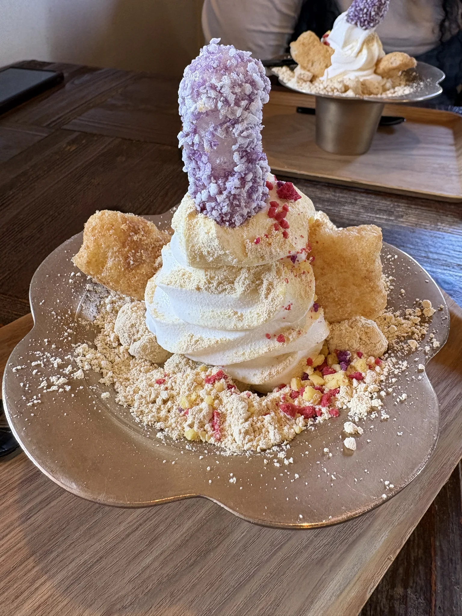 _Interesting_ Ice Cream A purple phallic-shaped Injeolmi rice cake sits on ice-cream on a metal bowl